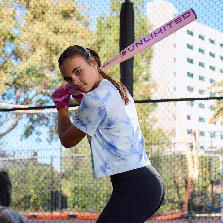 Softball player preparing to hit with 2026 Easton Ghost Unlimited bat