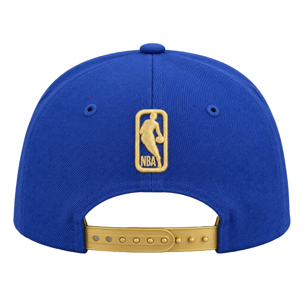 A royal blue baseball cap shown from the back, featuring a gold embroidered NBA logo patch on the center back and a gold metal adjustment strap.