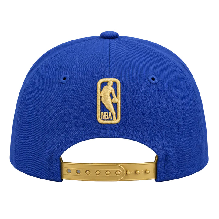 A royal blue baseball cap shown from the back, featuring a gold embroidered NBA logo patch on the center back and a gold metal adjustment strap.