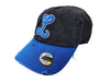 Black and blue cap with a logo on a mannequin in a store setting